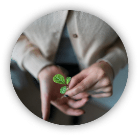 woman holding a plant that symbolized growth