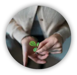 woman holding a plant that symbolized growth