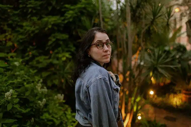 woman in denim jacket in garden
