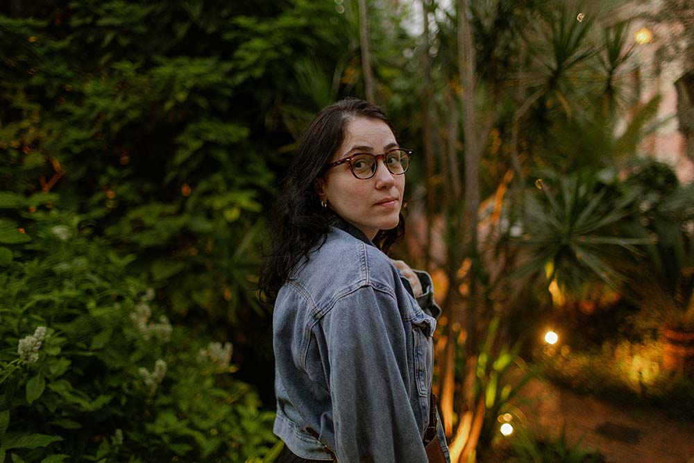 woman in denim jacket in garden