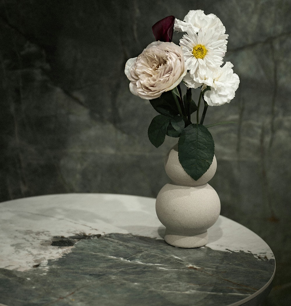 A hand holding a delicate flower, symbolizing self-worth, growth, and the nurturing of inner confidence.