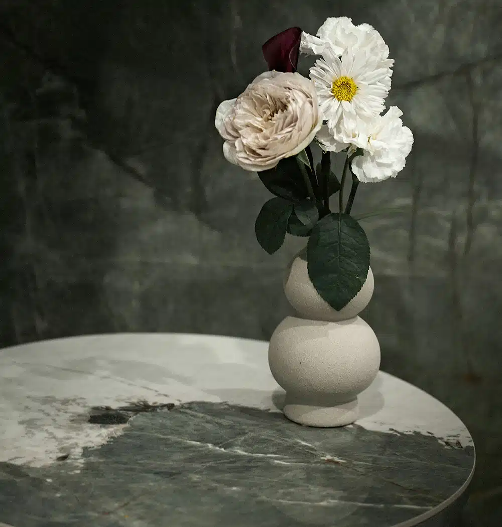 A hand holding a delicate flower, symbolizing self-worth, growth, and the nurturing of inner confidence.